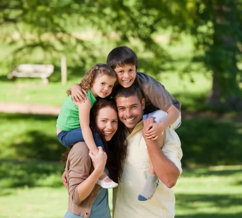 parents-giving-children-piggyback-1-scaled